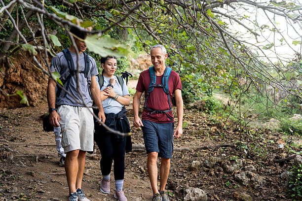 istock Friends hiking forest trail during autumn day 2239720817