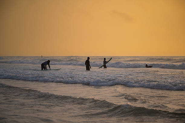 Man is surfing on Canggu beach, Bali Island.Indonesia.