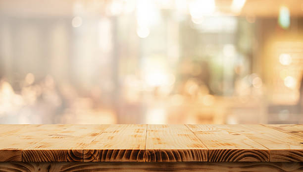 istock Wood table top (Bar) with blur light gold bokeh in dark night cafe,restaurant 2239728514