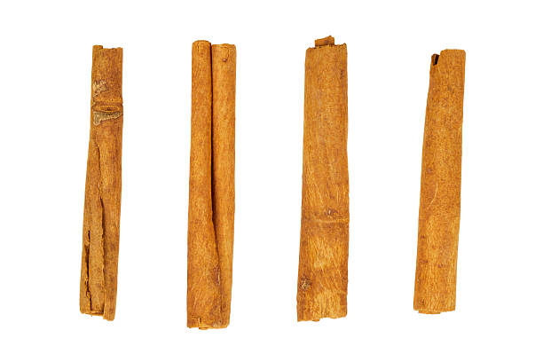 istock christmas cinnamon sticks isolated on white 2239732068