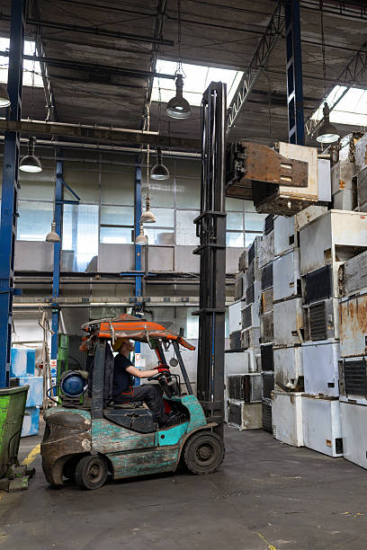 istock Industrial Worker Driving Forklift in Scrap Facility 2239732091