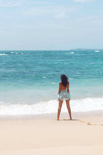 istock Young Woman Enjoying Ocean View On Tropical Beach 2239733420