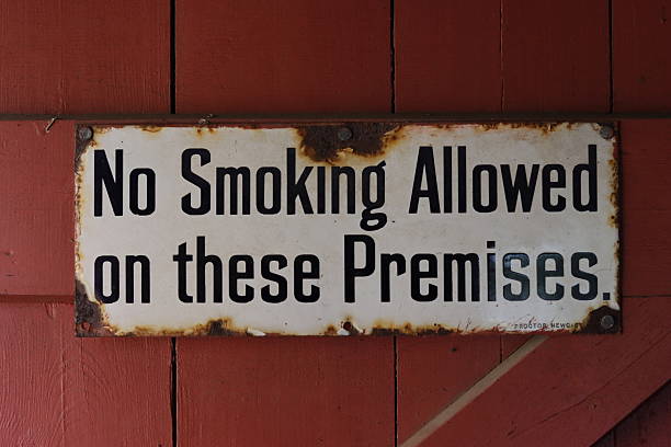 istock No smoking allowed on these premises - vintage sign 2239737875