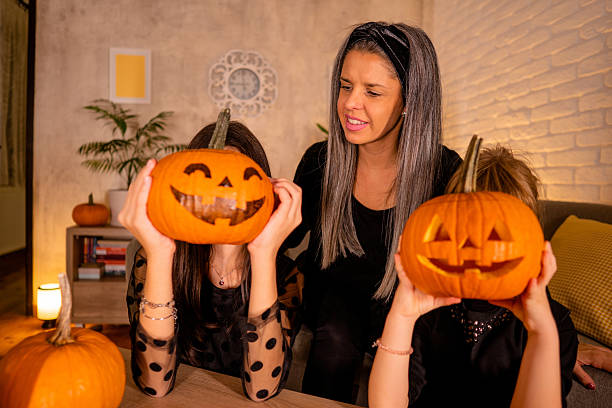 istock Mother with daughters preparing Halloween 2239739990