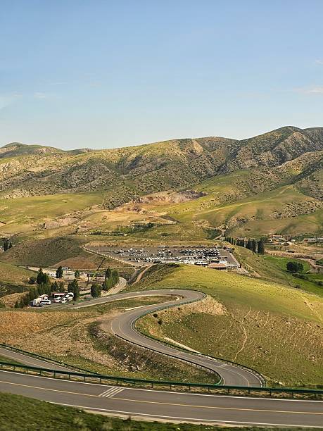 istock Winding Highway Road Through Dry, Rolling Hills 2239740447
