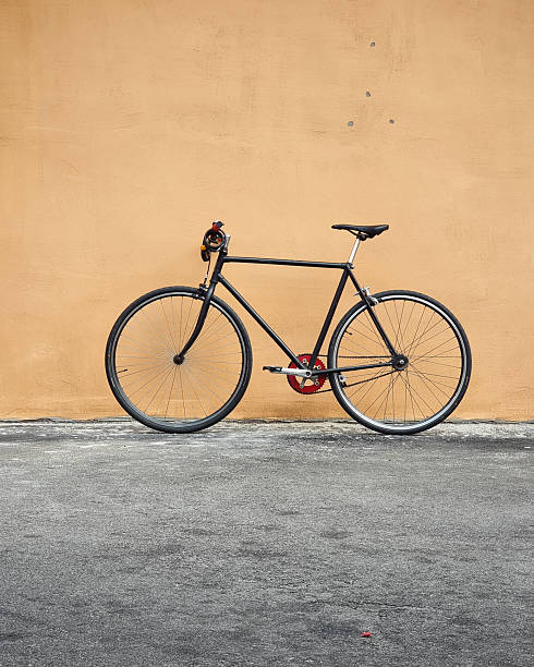 istock Old bicycle on the street. (vertical image) 2239741654