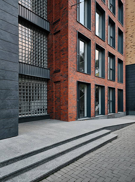 istock Modern building brick facade with glass blocks. 2239741848