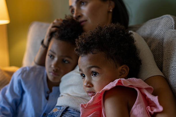 istock Family Embracing and Relaxing on the Sofa 2239742535
