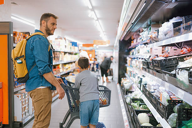 istock Young boy learning to shop with dad 2239744860
