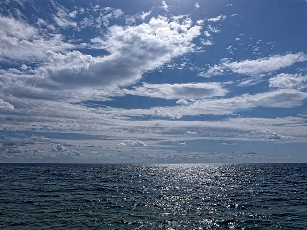 istock cloudy sky and blue sea view on a sunny day 2239745204