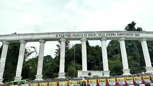 Bogor, Indonesia - Sept 17, 2025: An amazing view of the famous pillar building (Tepas Lawang Salapan Dasakerta) near the iconic landmark of Tugu Kujang Bogor.