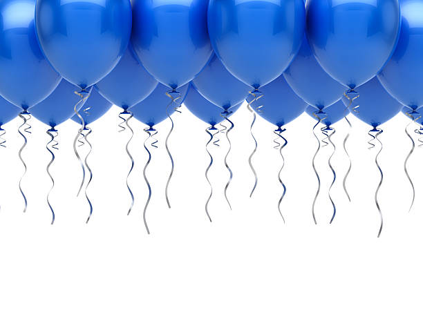 istock Blue balloons with long, twisting silver ribbons hanging down against a clean white backdrop. 2239746491