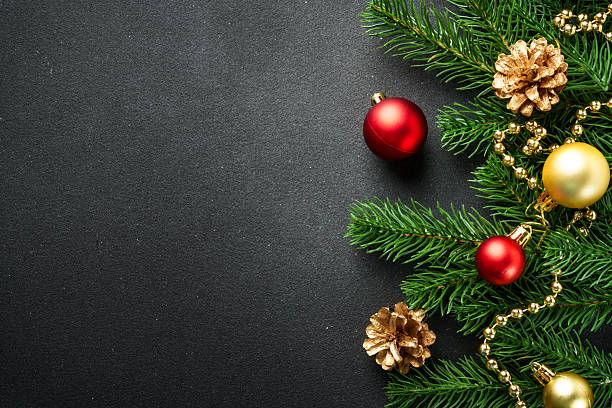 istock Christmas flat lay background with fir tree and holiday decorations on black. 2239746936