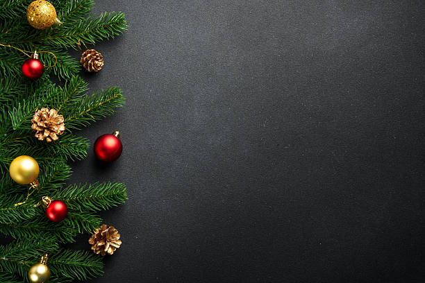 istock Christmas flat lay background with fir tree and holiday decorations on black. 2239746985