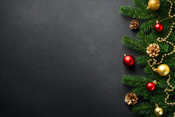 istock Christmas flat lay background with fir tree and holiday decorations on black. 2239746993