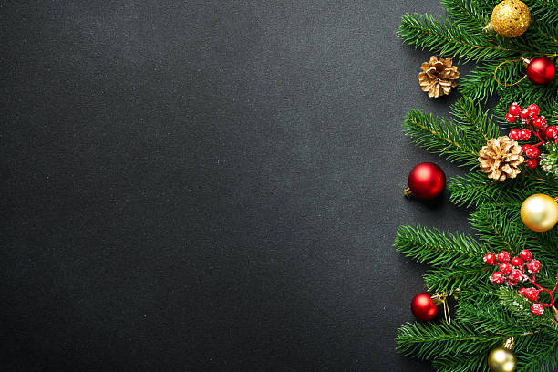 istock Christmas flat lay background with fir tree and holiday decorations on black. 2239747133