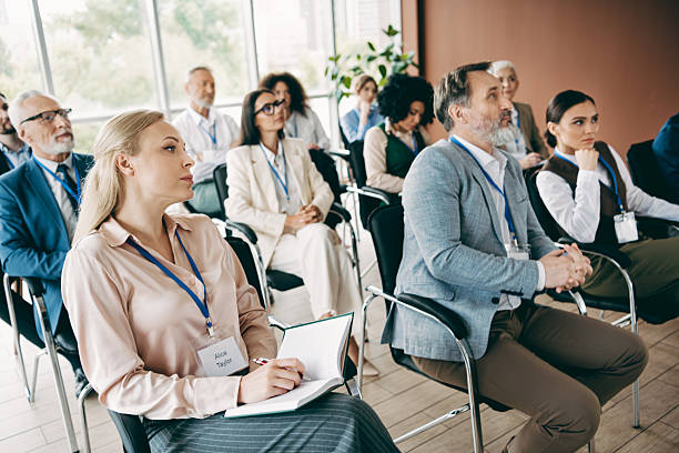 istock Professional team members attending an insightful business workshop in a modern office setting with collaborative ideas 2239747945