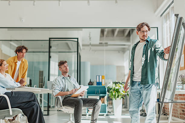 istock Young adults collaborating in a modern office setting during a team meeting focused on strategic planning 2239749691