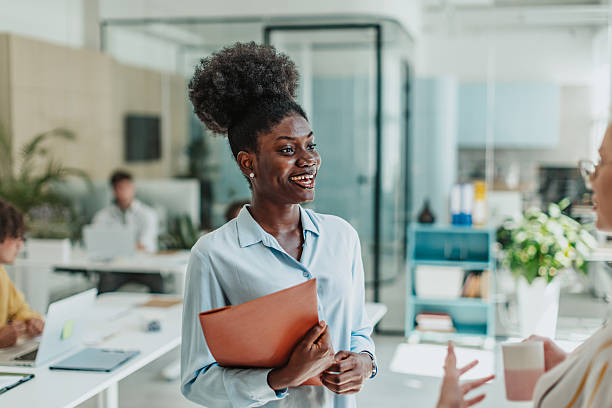 istock Young people engaged in collaborative work in a modern office setting creating a positive and productive atmosphere 2239750610