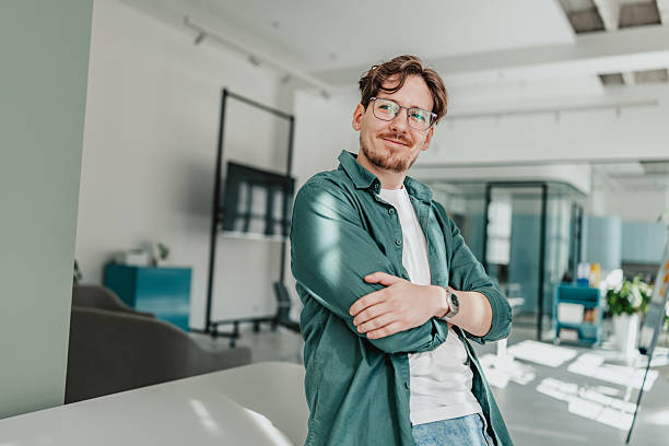 istock Young person engaged in professional work in a modern office setting, showcasing teamwork and communication skills 2239750830