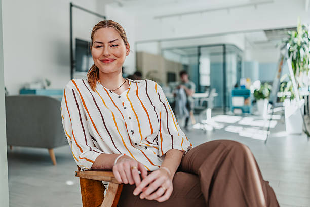 istock Young professional enjoying a moment of relaxation while working in a modern office environment 2239751927
