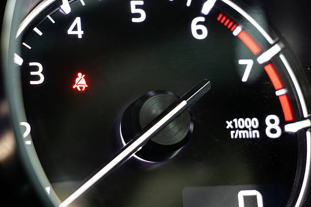 istock A dashboard with tachometer of car, close up. 2239752455