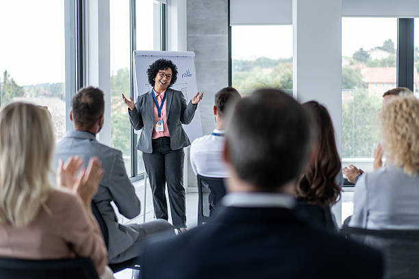 istock Confident Presenter Speaking to Audience in Conference Room 2239754335