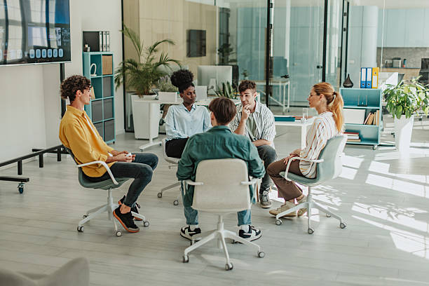 istock Young professionals collaborate in a modern office environment during a team meeting focused on innovative strategies and solutions 2239754488