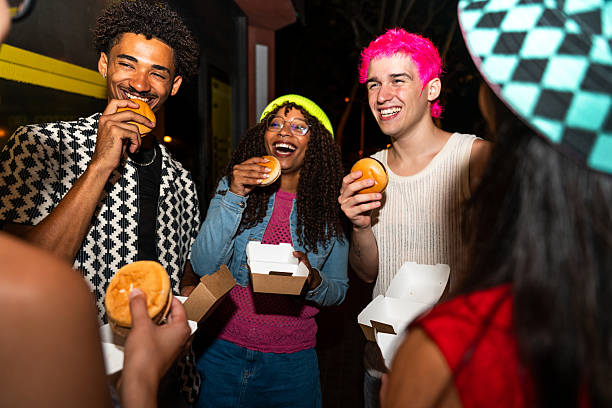 istock Multiethnic group of young friends having fun on the stretts in 2239755021