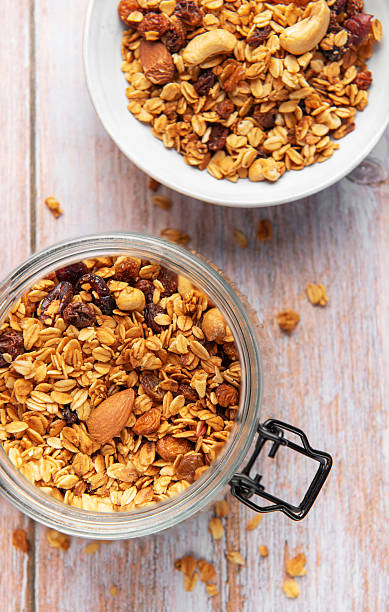 istock Granola cereal in glass jar, healthy breakfast concept 2239756295