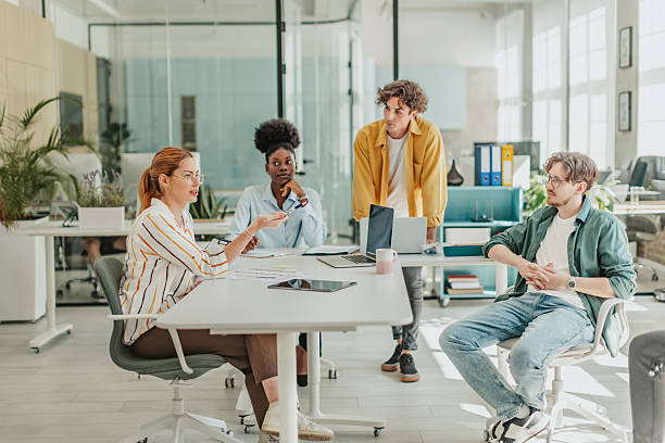 istock Young professionals engage in a productive meeting at a modern office space while collaborating on a project 2239756623