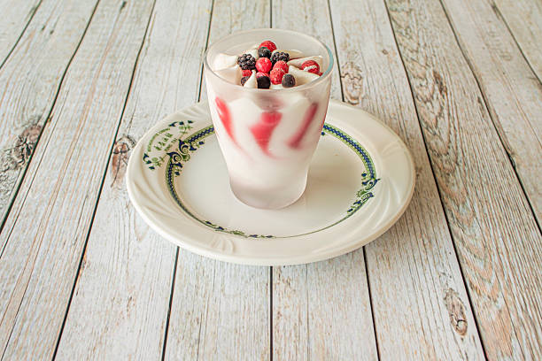 Cup of cream ice cream with berries
