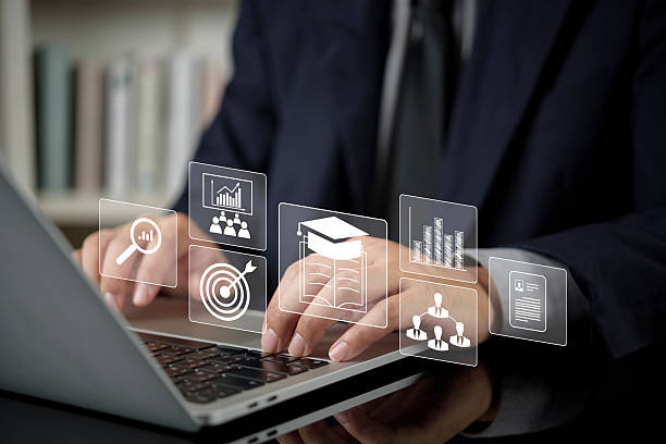 istock Businessman using laptop for Human Resources HR management. Employee training, career development, recruitment data analysis. Concept of skill, goal, education, business strategy for success. 2239758809