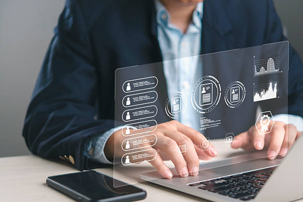 istock Businessman analyzing employee performance on HR management software dashboard. Reviewing digital CVs, personnel data for corporate development. Technology for modern recruitment strategy. 2239758840
