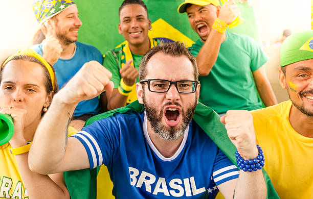 istock Brazilian fans at stadium. Cheering. 2239759328