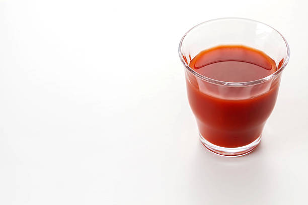 Delicious tomato juice on a white background