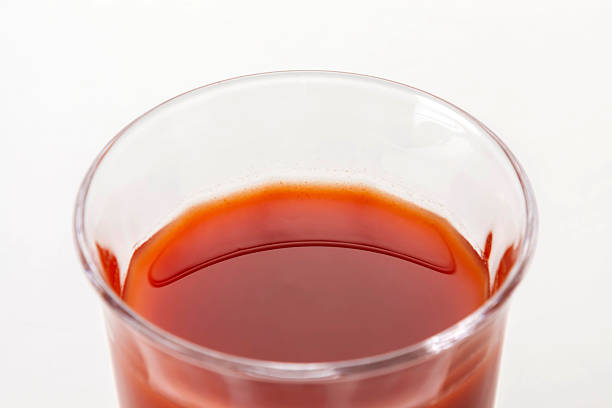 Delicious tomato juice on a white background