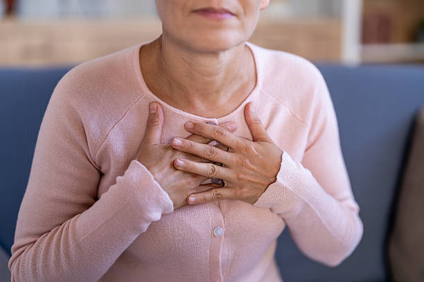 istock Woman experiencing chest pain, hands on heart, health problem 2239762673