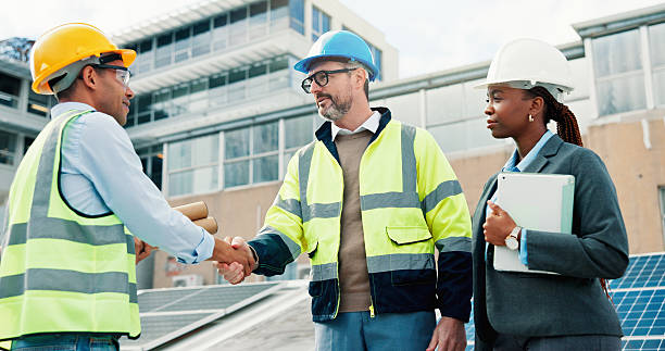 istock Solar panel, engineer or handshake with agreement outdoor for PV installation, system design or team. Photovoltaic partnership, people and shaking hands on rooftop for inspection compliance and deal 2239763935