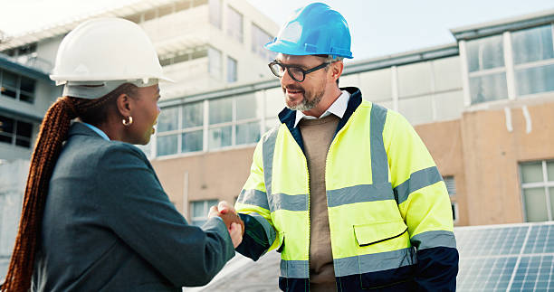 istock Solar panel, engineer or handshake with partnership outdoor for PV installation, project deal or team. Technician, people and shaking hands on rooftop for renewable energy and sustainable maintenance 2239763954