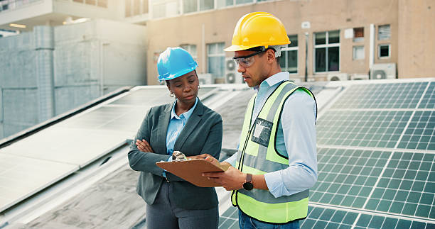 istock Clipboard, planning and solar energy with construction worker people on building roof for inspection. Architecture, collaboration or conversation with team outdoor to install photovoltaic panels 2239763973