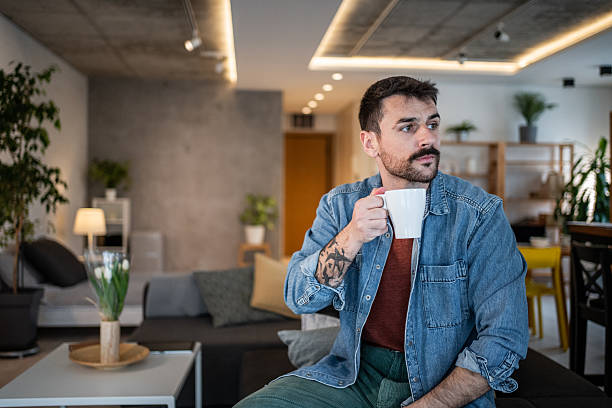 istock Man drinking coffee at home, enjoying leisure time 2239766070