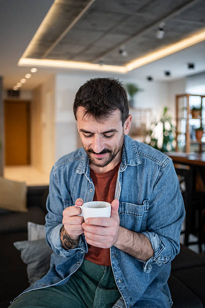 istock Man relaxing at home enjoying morning coffee 2239766162