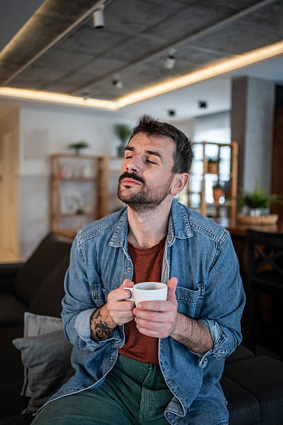 istock Man enjoying coffee aroma relaxing at home 2239766167