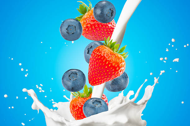 istock Fresh Berrys and Milk Splash On White Background 2239770517