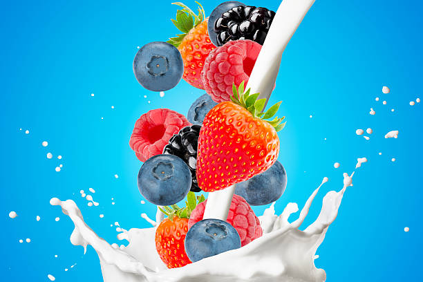 istock Fresh Berrys and Milk Splash On White Background 2239770566
