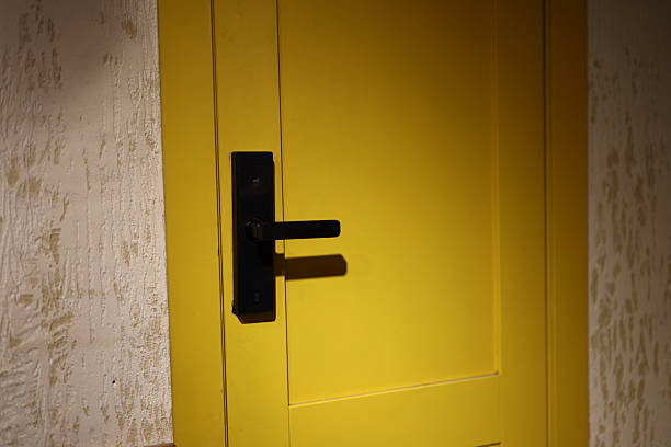 istock An EyeCatching Yellow Door Featuring a Modern Handle Design That Effectively Attracts Attention 2239773249