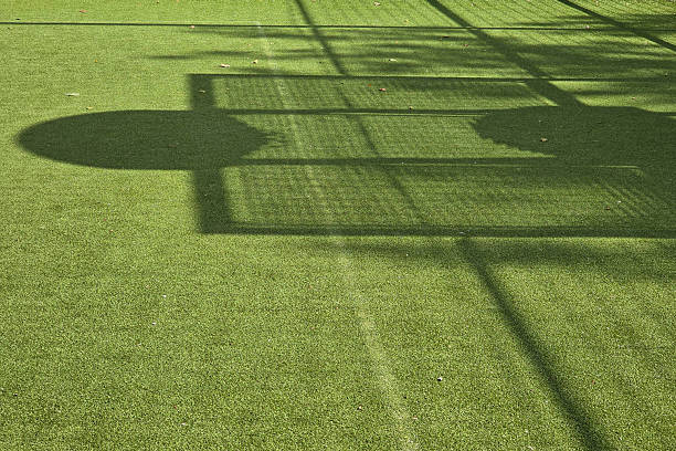 istock Shadows from basketball hoops and fencing 2239774886