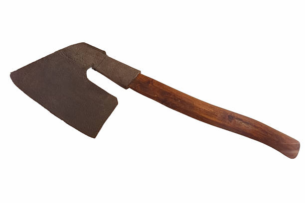 istock Vintage cleaver with a wooden handle resting on a plain surface 2239775125