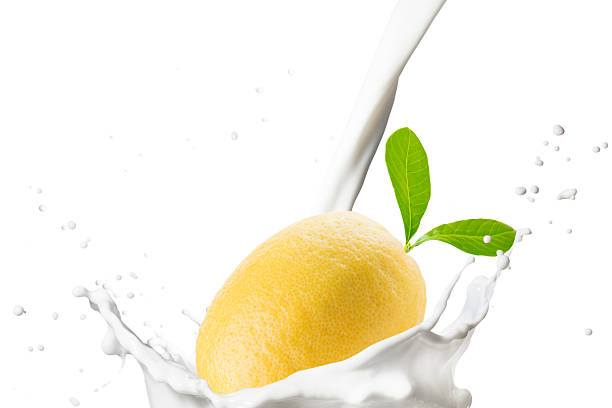 Milk Pour on Milk Splash With Lemon Fruits